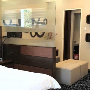 Voodi või voodid majutusasutuse Luxurious Family Room Pico de Loro toas