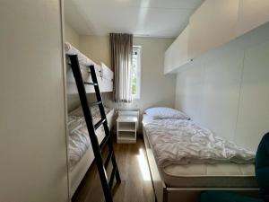 Ένα ή περισσότερα κρεβάτια σε δωμάτιο στο Unique chalet for 5 with garden