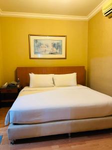 Postel nebo postele na pokoji v ubytování RESORT SUITES AT BARJAYA TIMES SQUARE kL