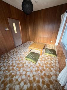Postel nebo postele na pokoji v ubytování ゲストハウス古道