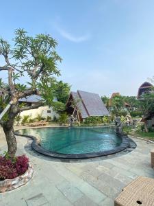 Bazén v ubytování Ringsun Homestay Uluwatu nebo v jeho okolí