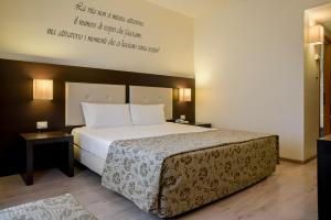 Postel nebo postele na pokoji v ubytování Hotel Executive