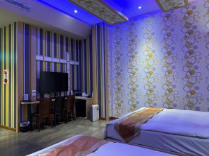 Televisyen dan/atau pusat hiburan di Wei Feng Exquisite Motel Pintung Branch