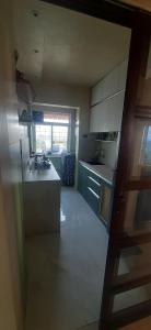 a kitchen with a counter and a stove top oven at Cozy Vibes in Navi Mumbai