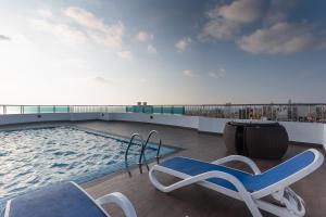 a swimming pool on the roof of a building at Supun Arcade Residency in Colombo