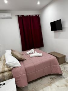 Letto o letti in una camera di Casa Rosa