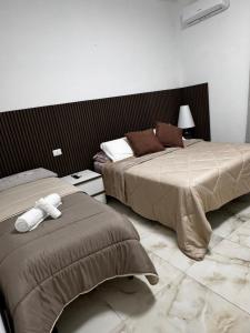 Letto o letti in una camera di Casa Rosa