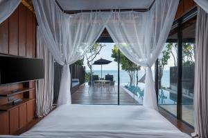 Postel nebo postele na pokoji v ubytování Silavadee Pool Spa Resort - SHA Extra Plus