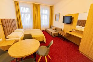 TV a/nebo společenská místnost v ubytování Hotel Klimt