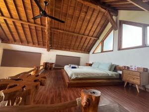 Postel nebo postele na pokoji v ubytování Ringsun Homestay Uluwatu