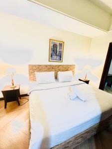 Postel nebo postele na pokoji v ubytování RESORT SUITES AT BARJAYA TIMES SQUARE kL