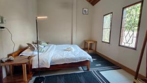 Ένα ή περισσότερα κρεβάτια σε δωμάτιο στο Mango Villa Nong Khiaw