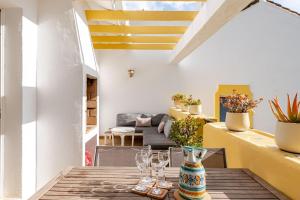 a room with a table with glasses and a couch at Casa Tropicana Family & Golf in Sitio de Calahonda +53 photos