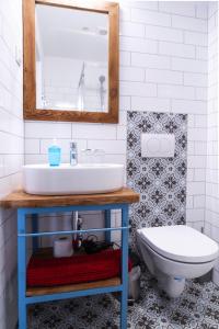a bathroom with a sink and a toilet at Mathias Rex in Szentendre