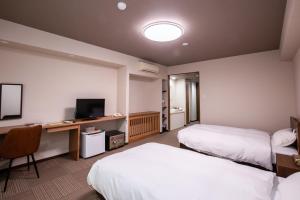 Postel nebo postele na pokoji v ubytování Hotel Umenoyu