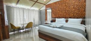 Ένα ή περισσότερα κρεβάτια σε δωμάτιο στο Vila's Club Resort +21 φωτογραφίες