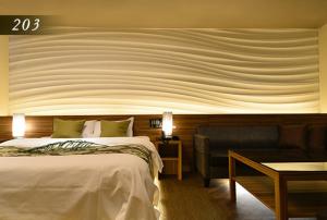 Ένα ή περισσότερα κρεβάτια σε δωμάτιο στο Hotel Ayung 大人専用