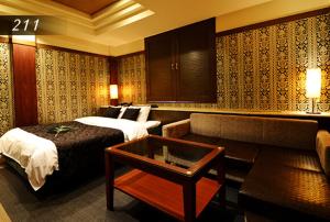 Ένα ή περισσότερα κρεβάτια σε δωμάτιο στο Hotel Ayung 大人専用