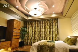 Ένα ή περισσότερα κρεβάτια σε δωμάτιο στο Hotel Ayung 大人専用