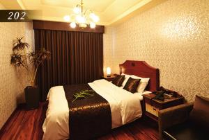 Ένα ή περισσότερα κρεβάτια σε δωμάτιο στο Hotel Ayung 大人専用