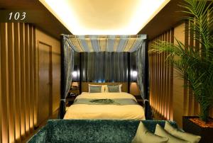 Ένα ή περισσότερα κρεβάτια σε δωμάτιο στο Hotel Ayung 大人専用