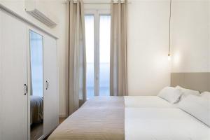 Posteľ alebo postele v izbe v ubytovaní Apartment in downtown Barcelona - Vintage