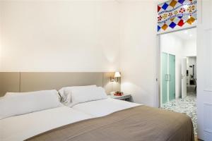 Posteľ alebo postele v izbe v ubytovaní Apartment in downtown Barcelona - Vintage