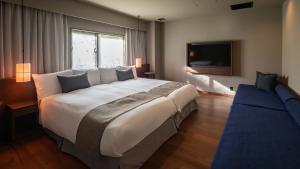 Ένα ή περισσότερα κρεβάτια σε δωμάτιο στο Nasu-Onsen Shinshun no Kago Hewitt Resort