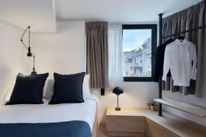 Una cama o camas en una habitación de MoRe by Zoia Living