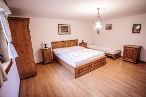 Postel nebo postele na pokoji v ubytování Mlýn Kozlovice
