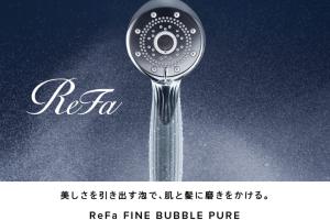 a shower head with water coming out of it at HOTEL MYSTAYS PREMIER Kanazawa in Kanazawa