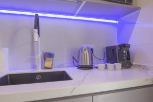 Coffee and tea making facilities at RentalSevilla Looks Pretty and modern