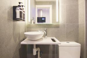 A bathroom at RentalSevilla Looks Pretty and modern