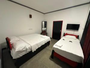 Postel nebo postele na pokoji v ubytování Calm Weligama