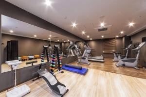 a gym with treadmills and machines in a room at HOTEL MYSTAYS PREMIER Kanazawa in Kanazawa