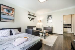 a bedroom with a bed and a living room at Basilica Downtown AC & Metro in Top Location in Budapest