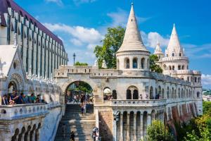 a building with a staircase in front of a building at Basilica Downtown AC & Metro in Top Location in Budapest