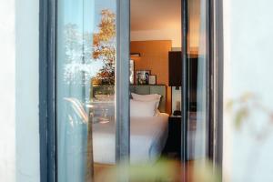 Letto o letti in una camera di Hotel Eiffel Blomet
