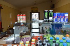 a counter filled with lots of different types of drinks at Hotel Dumanov in Bansko