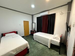 Postel nebo postele na pokoji v ubytování Calm Weligama