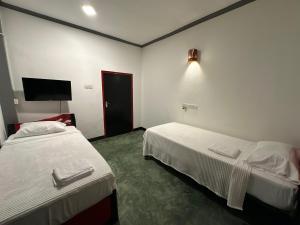 Postel nebo postele na pokoji v ubytování Calm Weligama