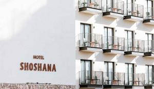 a building with balconies on the side of it at Hotel Shoshana - Adults Only in Eilat