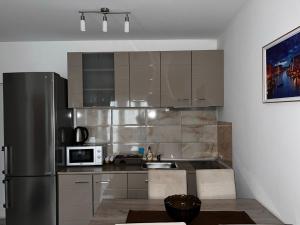 Kuchyň nebo kuchyňský kout v ubytování Angel Apartment Srebrno jezero