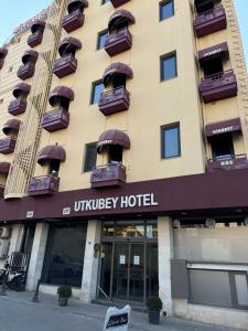 a hotel with balconies on a building at Utkubey Hotel in Gaziantep