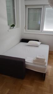 Posteľ alebo postele v izbe v ubytovaní Amaros Apartment
