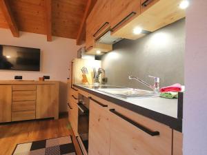 A kitchen or kitchenette at Apartment Piz Munschuns by Interhome
