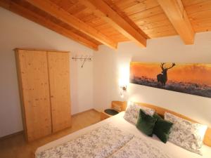 A bed or beds in a room at Apartment Piz Munschuns by Interhome