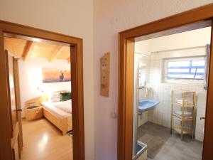 A bed or beds in a room at Apartment Piz Munschuns by Interhome