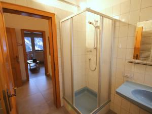 A bathroom at Apartment Piz Munschuns by Interhome