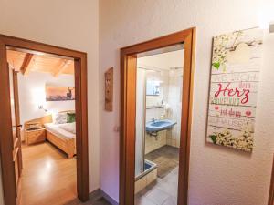 A bathroom at Apartment Piz Munschuns by Interhome